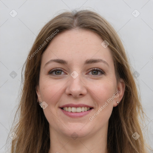 Joyful white young-adult female with long  brown hair and grey eyes