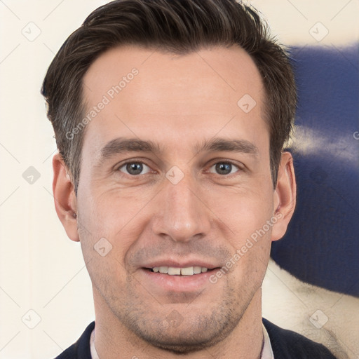 Joyful white adult male with short  brown hair and brown eyes