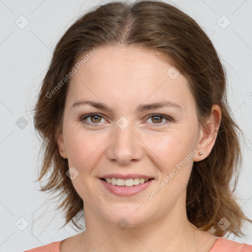 Joyful white young-adult female with medium  brown hair and green eyes