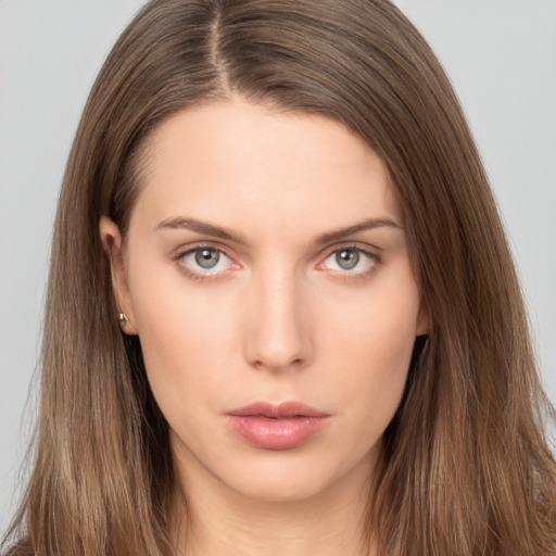 Neutral white young-adult female with long  brown hair and brown eyes