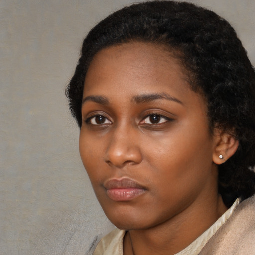 Neutral black young-adult female with short  black hair and brown eyes