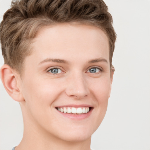 Joyful white young-adult female with short  brown hair and grey eyes