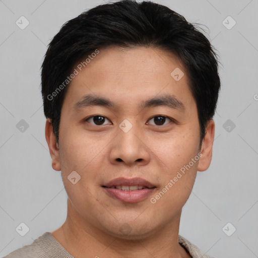 Joyful asian young-adult male with short  brown hair and brown eyes