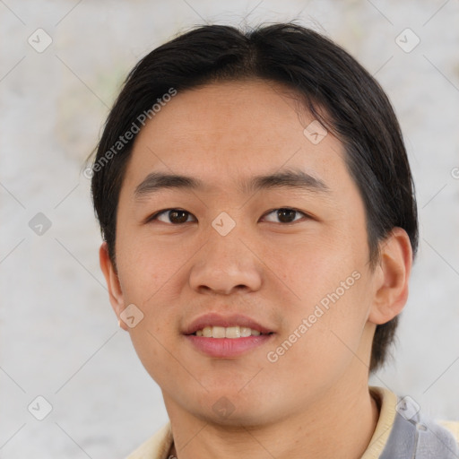 Joyful asian young-adult male with short  brown hair and brown eyes