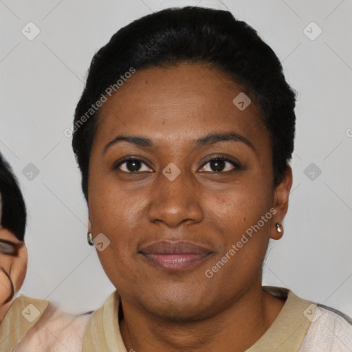 Joyful latino young-adult female with short  black hair and brown eyes