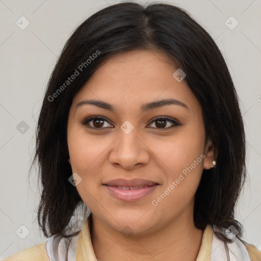 Joyful latino young-adult female with medium  brown hair and brown eyes