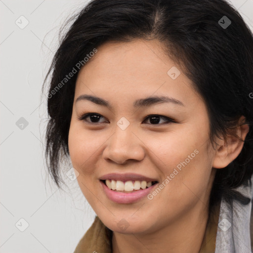 Joyful asian young-adult female with long  brown hair and brown eyes