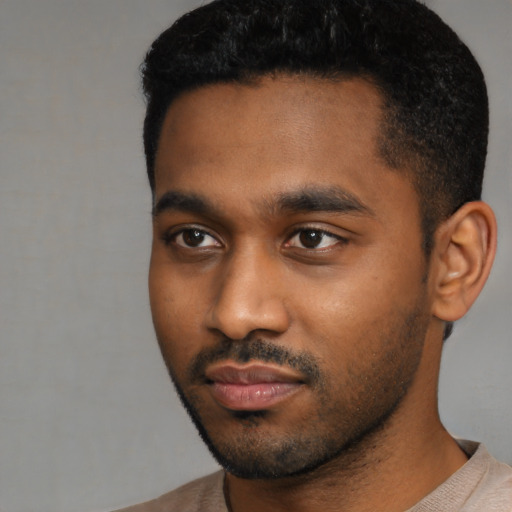 Neutral black young-adult male with short  black hair and brown eyes