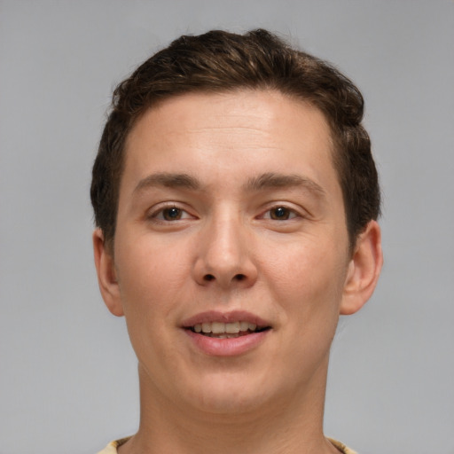 Joyful white young-adult male with short  brown hair and brown eyes