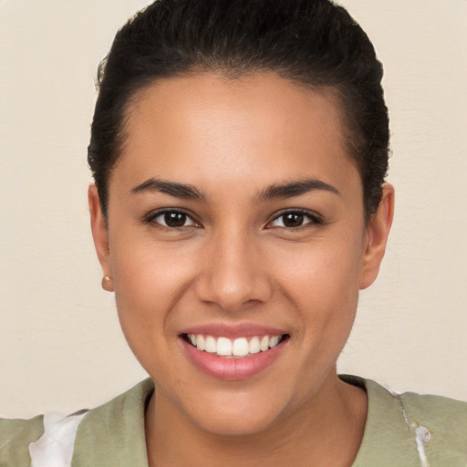 Joyful white young-adult female with short  brown hair and brown eyes