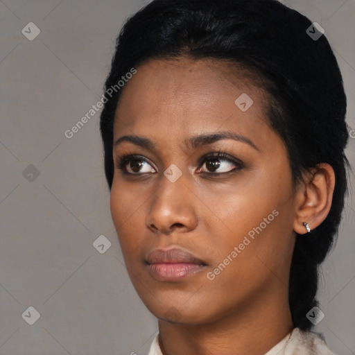 Neutral black young-adult female with short  black hair and brown eyes