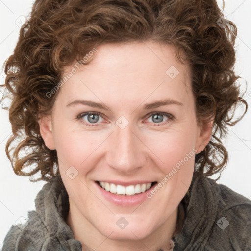 Joyful white young-adult female with medium  brown hair and green eyes