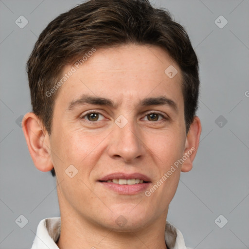 Joyful white adult male with short  brown hair and brown eyes