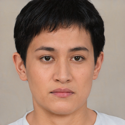 Joyful asian young-adult male with short  brown hair and brown eyes