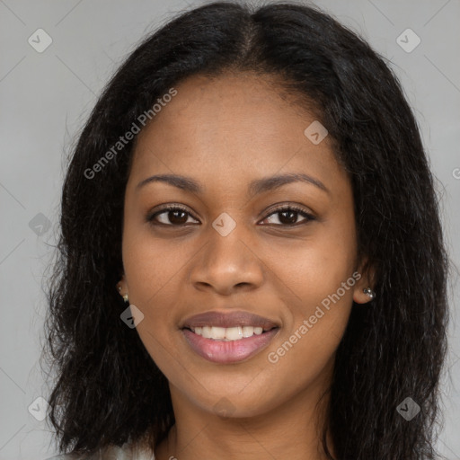 Joyful black young-adult female with long  brown hair and brown eyes