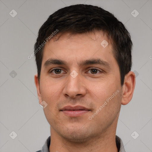 Joyful white young-adult male with short  brown hair and brown eyes