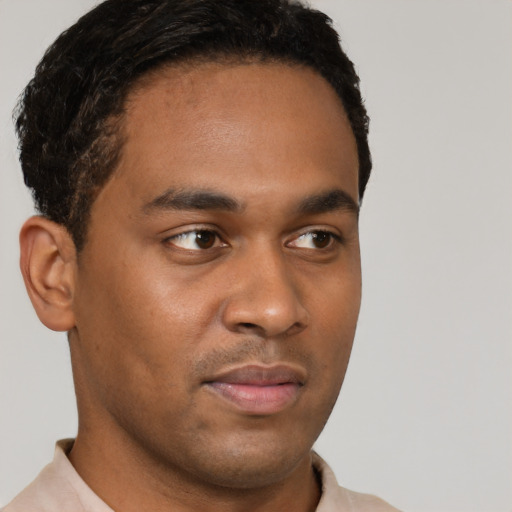Neutral black young-adult male with short  brown hair and brown eyes