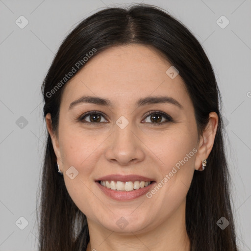 Joyful white young-adult female with long  brown hair and brown eyes