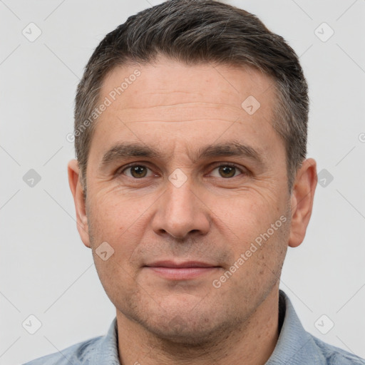 Joyful white adult male with short  brown hair and brown eyes