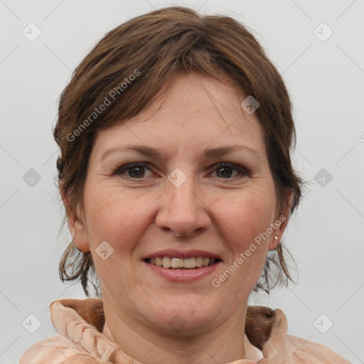 Joyful white adult female with medium  brown hair and brown eyes