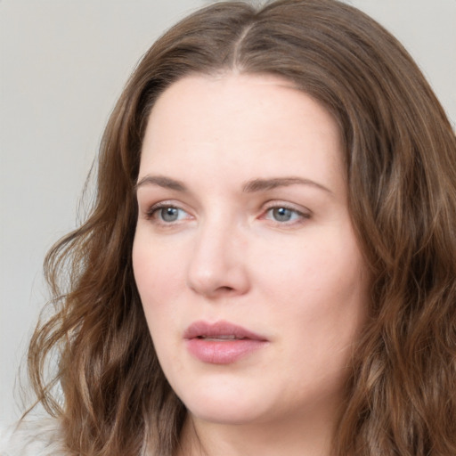 Neutral white young-adult female with long  brown hair and grey eyes