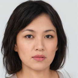 Neutral asian young-adult female with medium  brown hair and brown eyes