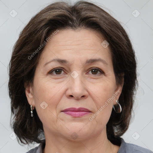 Joyful white adult female with medium  brown hair and brown eyes