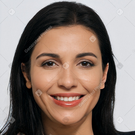 Joyful latino young-adult female with long  brown hair and brown eyes