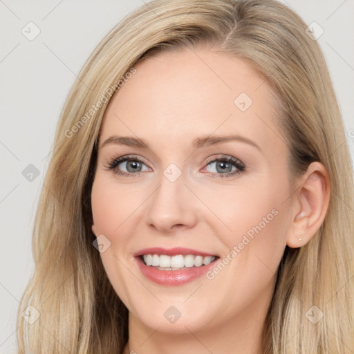 Joyful white young-adult female with long  brown hair and blue eyes