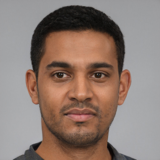 Neutral black young-adult male with short  black hair and brown eyes