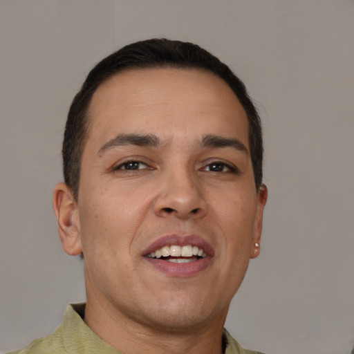 Joyful white adult male with short  brown hair and brown eyes