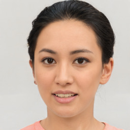 Joyful asian young-adult female with short  brown hair and brown eyes