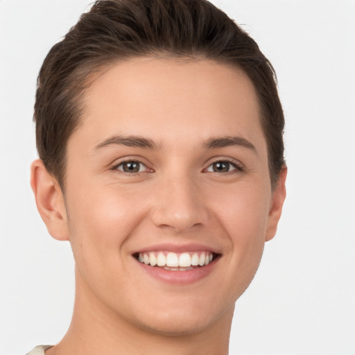 Joyful white young-adult female with short  brown hair and brown eyes