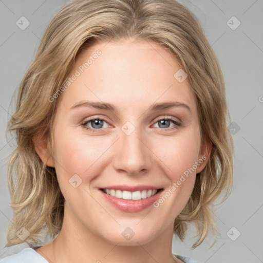 Joyful white young-adult female with medium  brown hair and blue eyes