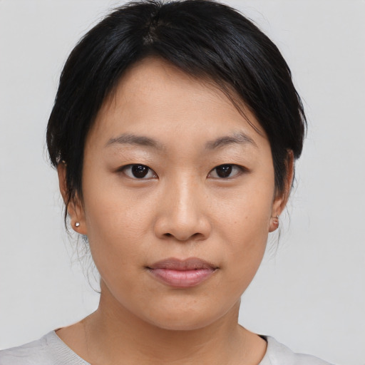 Neutral asian young-adult female with medium  brown hair and brown eyes