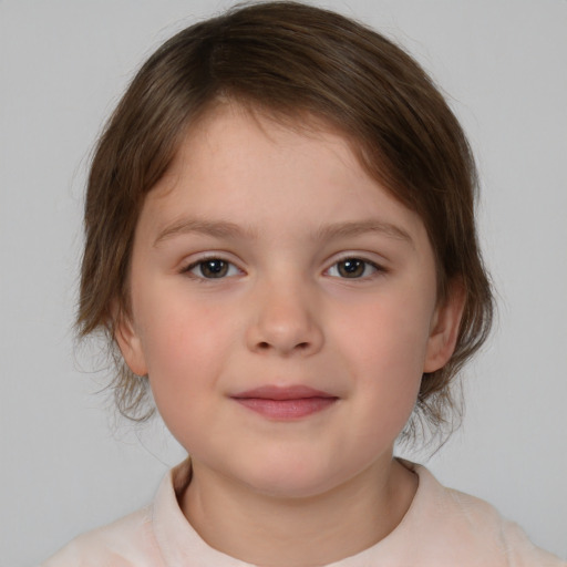 Joyful white child female with medium  brown hair and brown eyes