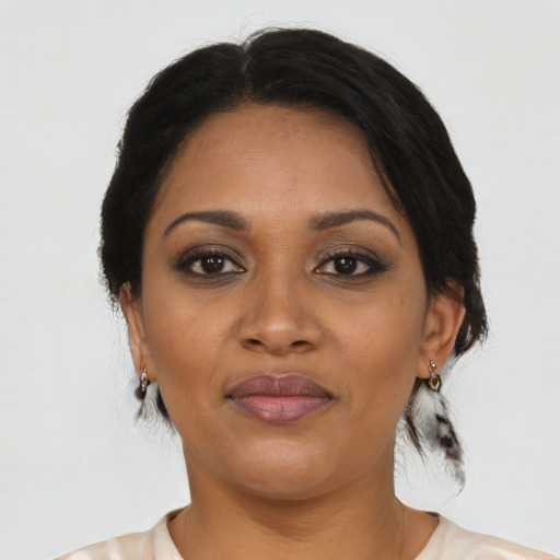 Joyful latino young-adult female with medium  black hair and brown eyes