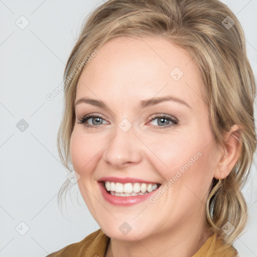 Joyful white young-adult female with medium  brown hair and blue eyes