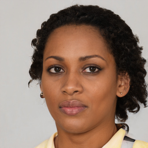 Neutral black young-adult female with medium  black hair and brown eyes