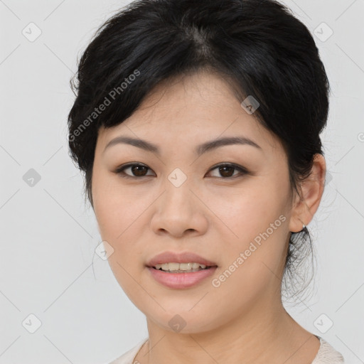 Joyful asian young-adult female with medium  brown hair and brown eyes