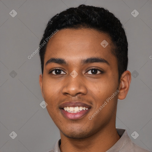 Joyful black young-adult male with short  black hair and brown eyes