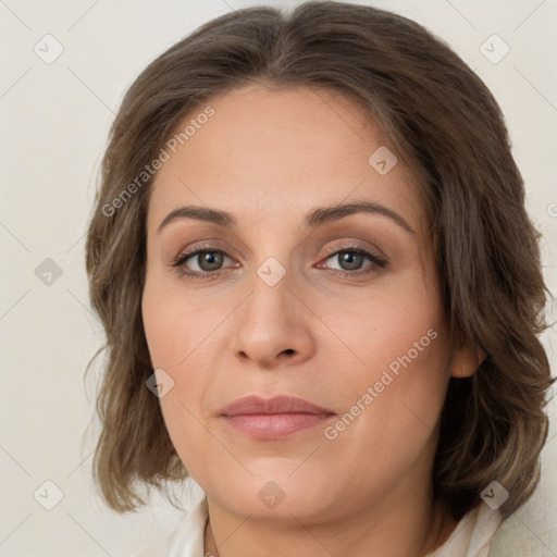 Joyful white young-adult female with medium  brown hair and green eyes