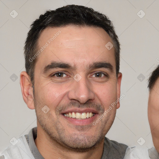 Joyful white adult male with short  black hair and brown eyes