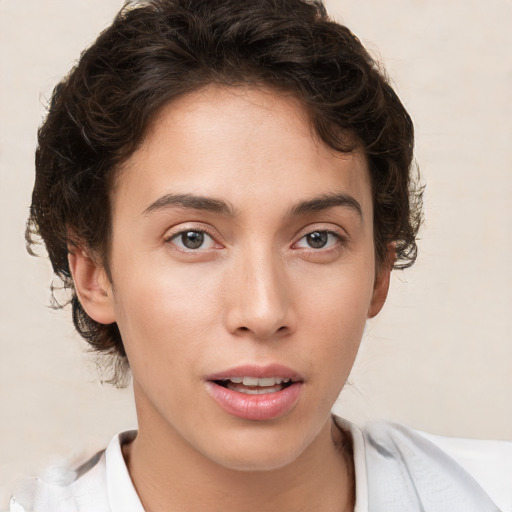 Neutral white young-adult female with short  brown hair and brown eyes