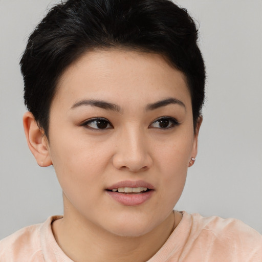 Joyful asian young-adult female with short  brown hair and brown eyes