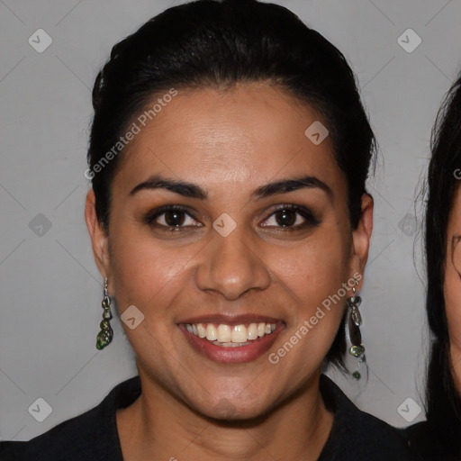 Joyful latino young-adult female with medium  brown hair and brown eyes