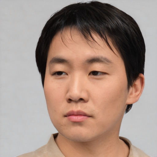 Neutral asian young-adult male with short  brown hair and brown eyes