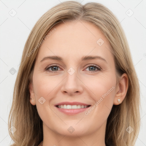 Joyful white young-adult female with long  brown hair and grey eyes