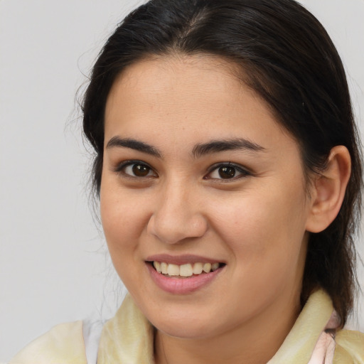 Joyful white young-adult female with medium  brown hair and brown eyes
