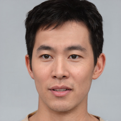 Neutral asian young-adult male with short  black hair and brown eyes